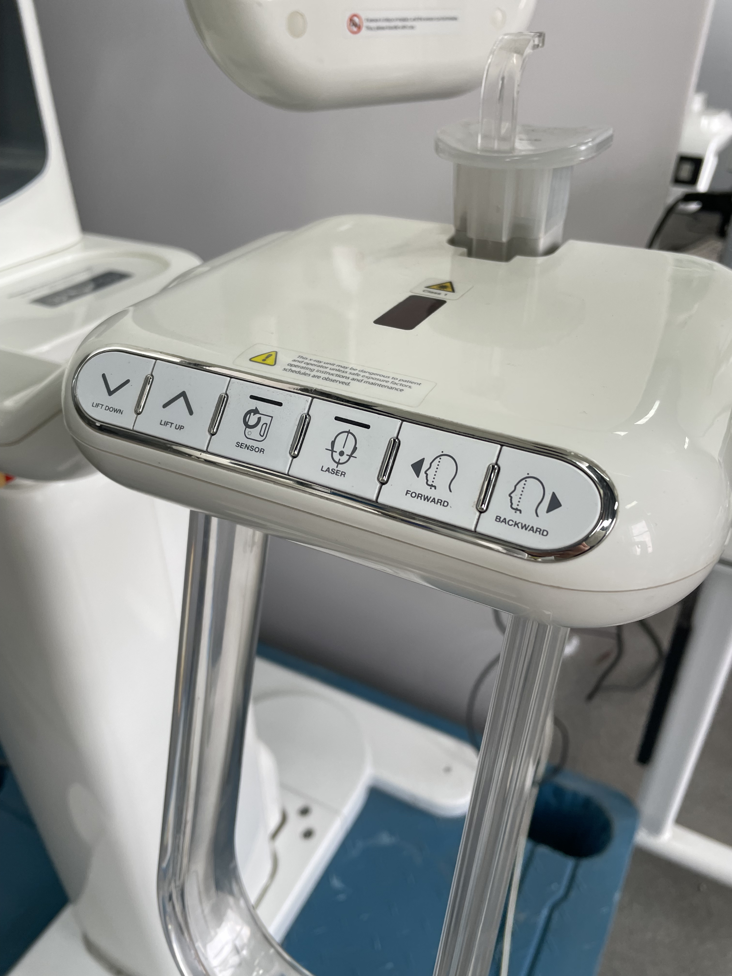 Genoray PAPAYA Plus operator control panel with LIFT DOWN, LIFT UP, SENSOR, LASER, FORWARD, BACKWARD buttons