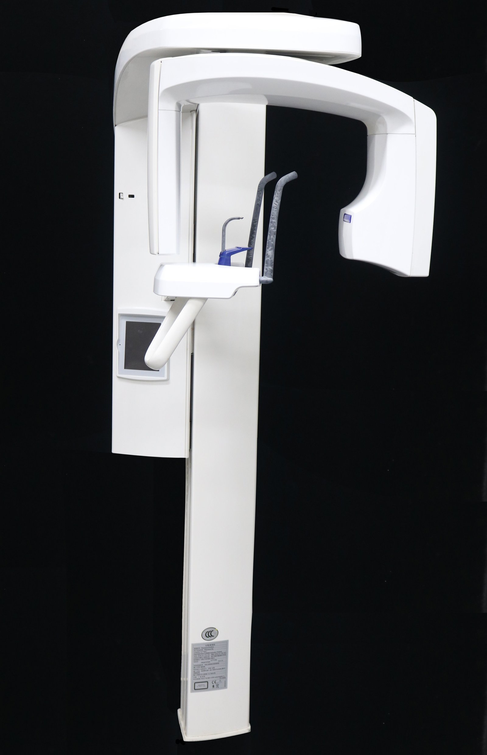 Side-mounted colour touchscreen control panel on the Planmeca ProOne column showing program selection interface